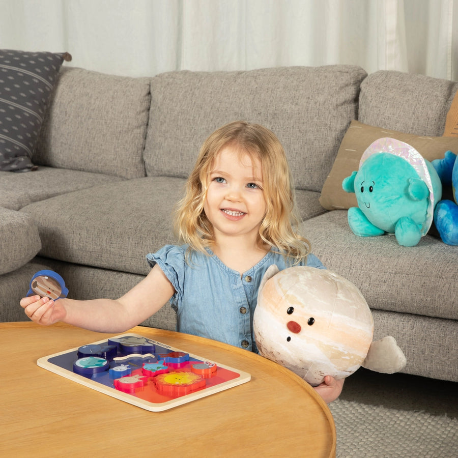 Child playing with educational toys in a living room